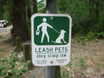 Sign - leash pets - obey scoop law